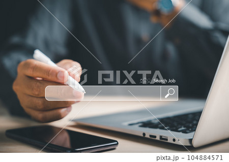 Man using a digital pen to point at an online job search bar, symbolizing the quest to find the perfect career opportunity amidst a sea of information and possibilities. job search Man using a digital pen to point at an online job search bar, symbolizing the quest to find the perfect career opportunity amidst a sea of information and possibilities. job search 104884571