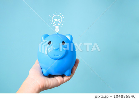 Piggy bank with virtual lightbulb, Financial business investment, Growing money, People saving money, Money saving for future, Idea for saving and investment Piggy bank with virtual lightbulb, Financial business investment, Growing money, People saving money, Money saving for future, Idea for saving and investment 104886946