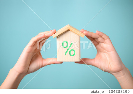 Wooden block with signs and symbols of percentage and arrow up 104888199