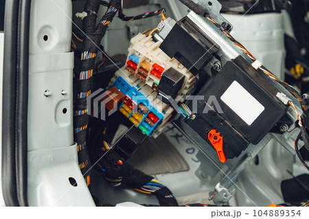 Electric wiring system with colorful wires in the car Electric wiring system with colorful wires in the car 104889354