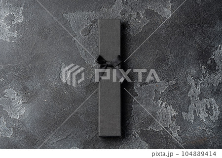 Small jewelry box on gray background close up Small jewelry box on gray background close up 104889414