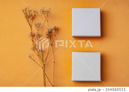 Jewelry box on orange background close up 104889555