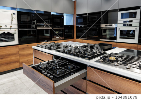 Modern cooking stoves on display in the store Modern cooking stoves on display in the store 104891079