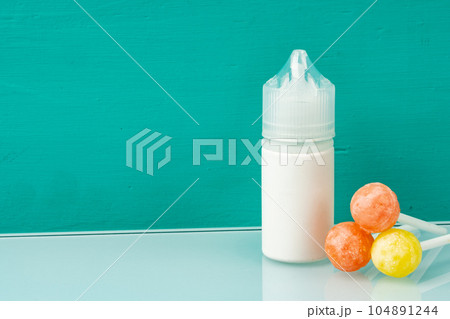 Bottle with aromatic vaping liquid for e-cigarette, candy flavour Bottle with aromatic vaping liquid for e-cigarette, candy flavour 104891244