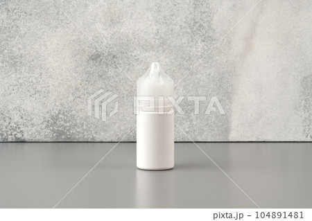 Refill liquid for electronic cigarettes on gray background 104891481