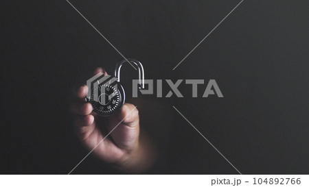 Man hand holding lockpad combination, unlock security concept. Man hand holding lockpad combination, unlock security concept. 104892766