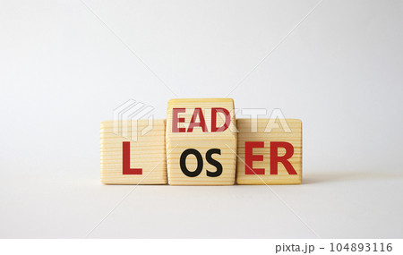 Leader vs Loser symbol. Wooden cubes with words Loser and Leader. Beautiful white background. Leader vs Loser and business concept. Copy space Leader vs Loser symbol. Wooden cubes with words Loser and Leader. Beautiful white background. Leader vs Loser and business concept. Copy space 104893116