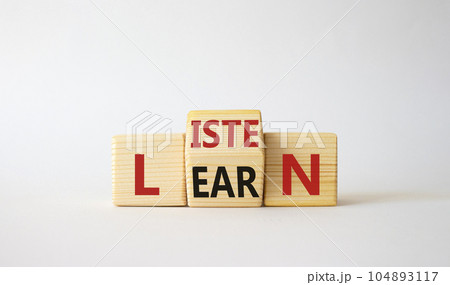 Listen and Learn symbol. Wooden cubes with words Learn and Listen. Beautiful white background. Listen and Learn and business concept. Copy space Listen and Learn symbol. Wooden cubes with words Learn and Listen. Beautiful white background. Listen and Learn and business concept. Copy space 104893117