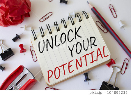 Unlock your Potential symbol. Concept words Unlock your Potential on white notebook. Beautiful white background. Business and Unlock your Potential concept. Copy space. 104893233