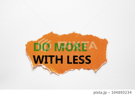 Do more with less symbol. Concept words Do more with less on torn orange paper. Beautiful white background. Business and Do more with less concept. Copy space. 104893234
