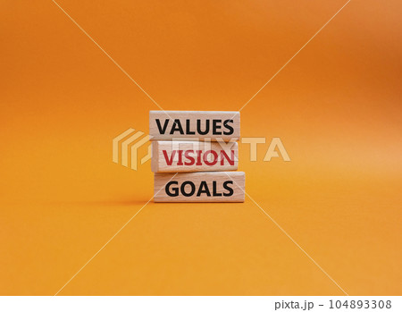 Values Vision Goals symbol. Concept words Values Vision Goals on wooden blocks. Beautiful orange background. Business and Values Vision Goals concept. Copy space. 104893308