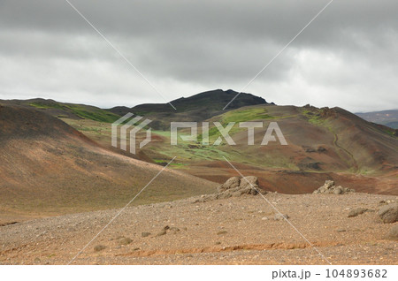 Beautiful view of the crater landscape and green peaks near Hverir, Iceland Beautiful view of the crater landscape and green peaks near Hverir, Iceland 104893682