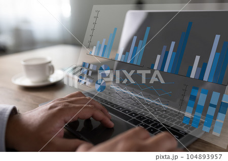 analyzing on a laptop Showing business analytics dashboard technology management strategy datum concept process report chart success investment statistic economy database 104893957