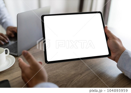 men using laptop computer working at office workspace with blank display white desktop screen monitor frame empty mockup for copy template advertising communication space 104893959