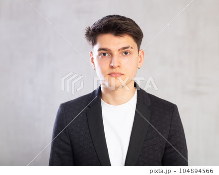 Portrait of serious young guy in business clothes Portrait of serious young guy in business clothes 104894566