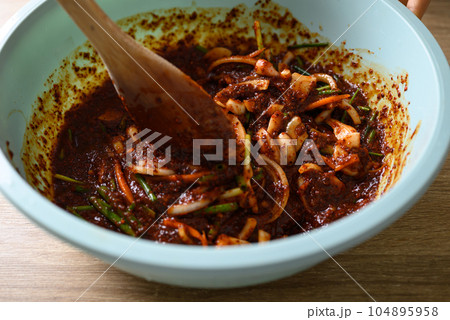 Korean food, Kimchi cabbage cooking in bowl, Homemade fermented side dish Korean food, Kimchi cabbage cooking in bowl, Homemade fermented side dish 104895958