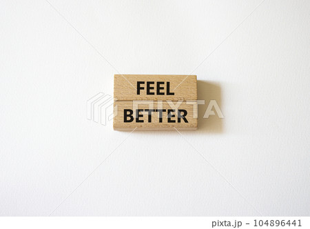 Feel better symbol. Wooden blocks with words Feel better. Beautiful white background. Business and Feel better concept. Copy space. 104896441