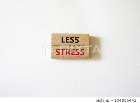 Less stress symbol. Wooden blocks with words Less stress. Beautiful white background. Healthcare and Less stress concept. Copy space. 104896442
