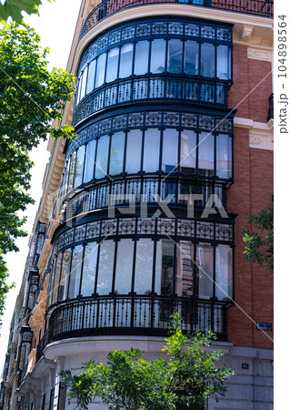 Typical balcony of Madrid with iron and glass coverage 104898564