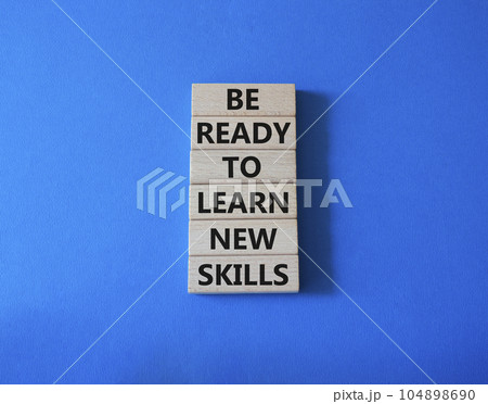Learn new skills symbol. Concept words Be ready to Learn new skills on wooden blocks. Beautiful blue background. Business and Learn new skills concept. Copy space. Learn new skills symbol. Concept words Be ready to Learn new skills on wooden blocks. Beautiful blue background. Business and Learn new skills concept. Copy space. 104898690