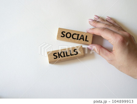 Social skills symbol. Wooden blocks with words Social skills Beautiful white background. Businessman hand. Business and Social skills concept. Copy space. Social skills symbol. Wooden blocks with words Social skills Beautiful white background. Businessman hand. Business and Social skills concept. Copy space. 104899913