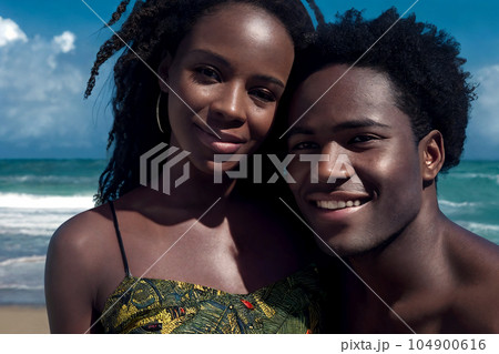 Two happy people on the sea beach 104900616