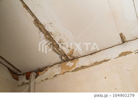 Damage ceiling from water pipelines leakage. Housing problem concept Damage ceiling from water pipelines leakage. Housing problem concept 104901279