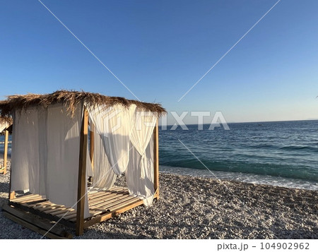 White beach canopies. Luxury beach tents at a resort. Beach concept 104902962