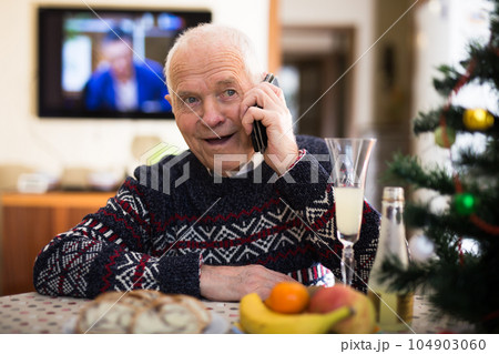 Elderly pensioner wishes Merry Christmas on the phone Elderly pensioner wishes Merry Christmas on the phone 104903060