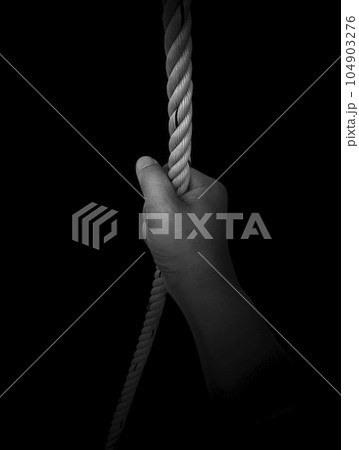 Man's hand holding on to the rope. On a white background 104903276