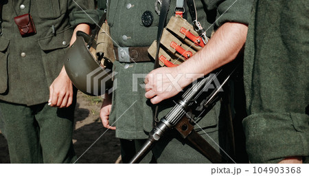 Re-enactor Dressed As German Wehrmacht Infantry Soldier In World War Ii With Submachine Gun Mp 40. German Soldier Uniform. German Soldier's Outfit 104903368