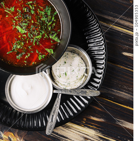 Ukrainian cuisine - borscht with sour cream 104905353