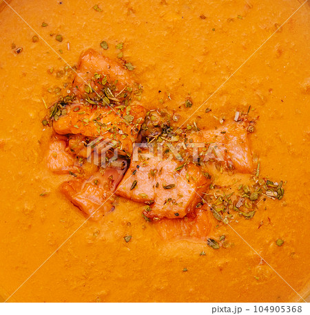 Carrot, pumpkin cream soup with salmon Carrot, pumpkin cream soup with salmon 104905368