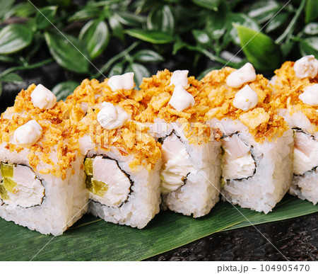 Japanese sushi roll on Black slate stone plate Japanese sushi roll on Black slate stone plate 104905470