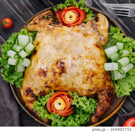Roast chicken with fresh vegetables top view 104905715