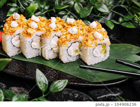 Japanese sushi roll on Black slate stone plate Japanese sushi roll on Black slate stone plate 104906236