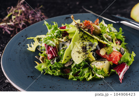 fresh salad with avocado, lettuce, microgreen, cabbage, cucumber 104906423