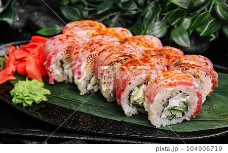Philadelphia sushi rolls with filling of cream cheese, cucumbers with fresh tuna fillet Philadelphia sushi rolls with filling of cream cheese, cucumbers with fresh tuna fillet 104906719