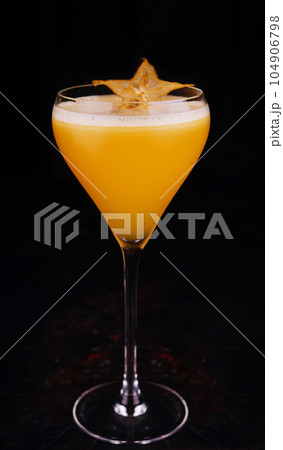 refreshing carambola martini cocktail with champagne 104906798