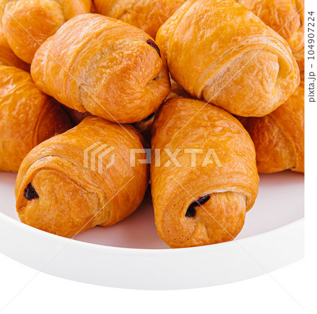 Tasty buns rolls with jam filling on plate 104907224