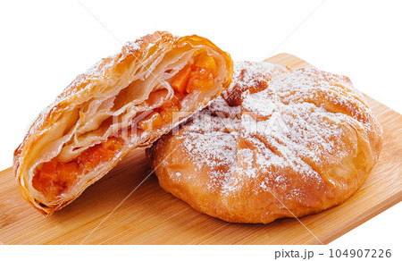 sweet pumpkin buns on wooden board 104907226