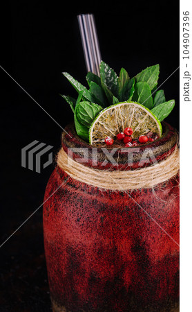 exotic tropical cocktail on black background exotic tropical cocktail on black background 104907396