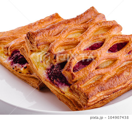 Delicious puff pastry with raspberry jam Delicious puff pastry with raspberry jam 104907438