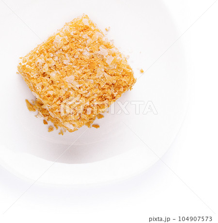 Slice of Napoleon Cake on top view 104907573