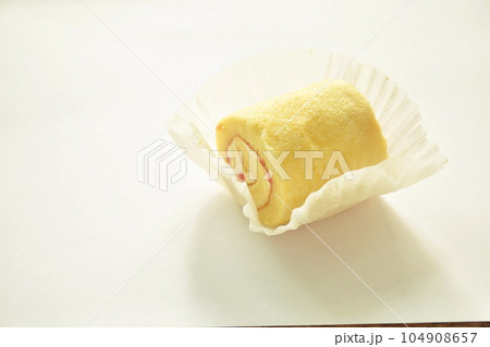 jam roll filling vanilla cream on paper in white background jam roll filling vanilla cream on paper in white background 104908657