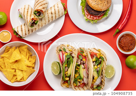 Mexican food featuring tacos, burritos, nachos, burgers 104908735