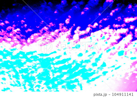 Wavy clouds float across the blue sky. Colorful sky background. Changed color scheme. 104911141