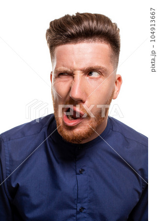 Attractive young man wearing blue shirt, isolated over a white background. Attractive young man wearing blue shirt, isolated over a white background. 104913667