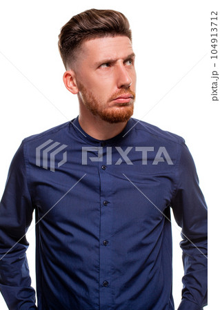 Attractive young man wearing blue shirt, isolated over a white background. 104913712