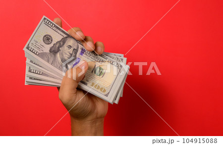 Hundred dollar bills on red background, Banknotes for money saving, Cash money dollars, Business investment and income, Global financial crisis, Earning and saving money concept Hundred dollar bills on red background, Banknotes for money saving, Cash money dollars, Business investment and income, Global financial crisis, Earning and saving money concept 104915088